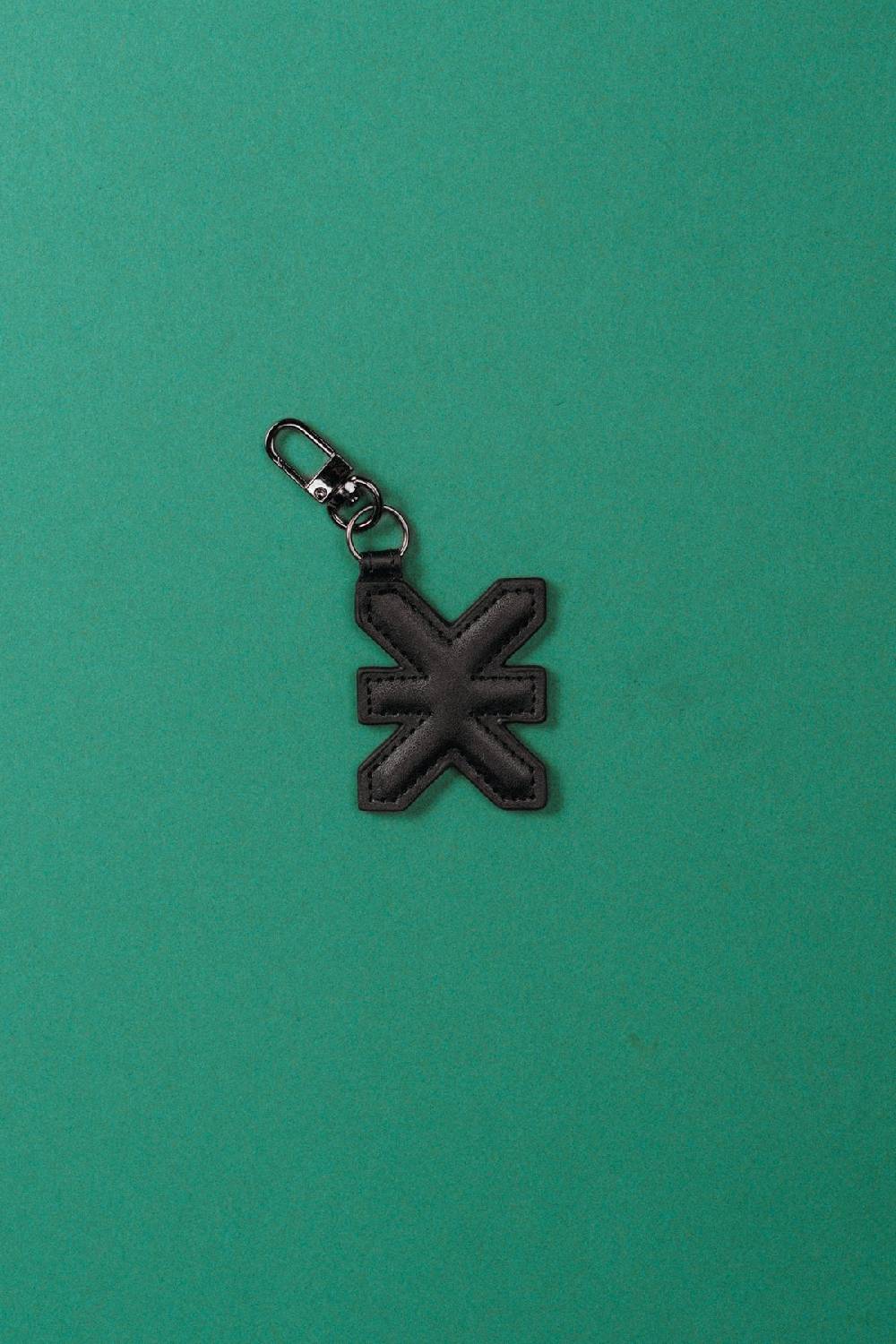 Karo Kauer Puffer Charm Logo