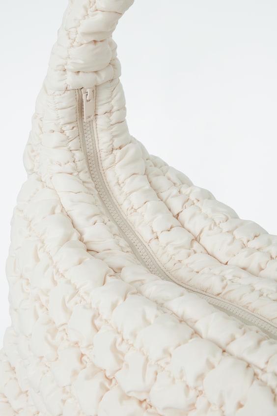 HM GROSSE GESTEPPTE UMHÄNGETASCHE