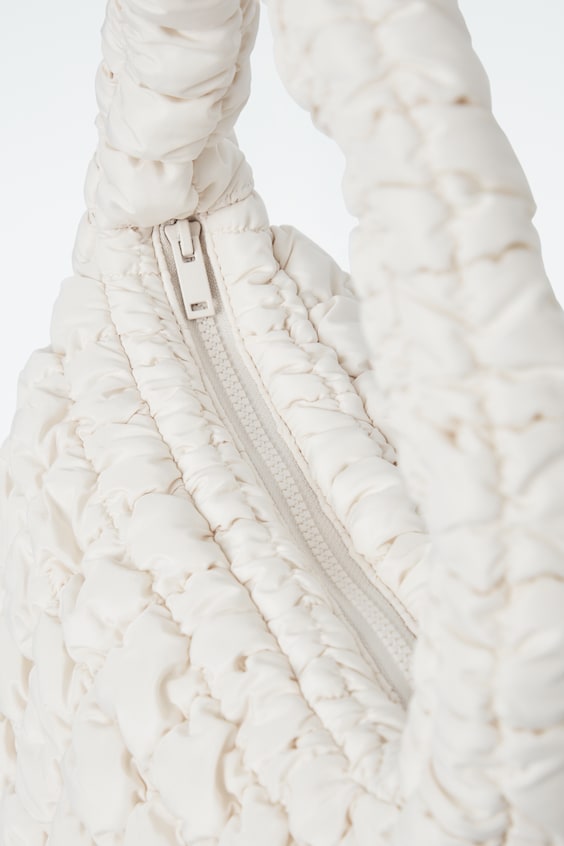 HM KLEINE GESTEPPTE TASCHE