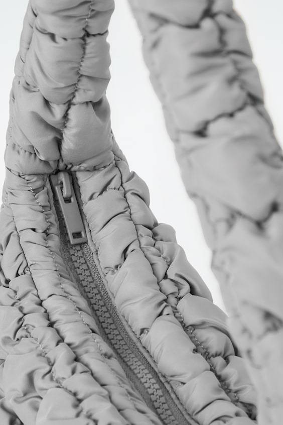 HM KLEINE GESTEPPTE TASCHE