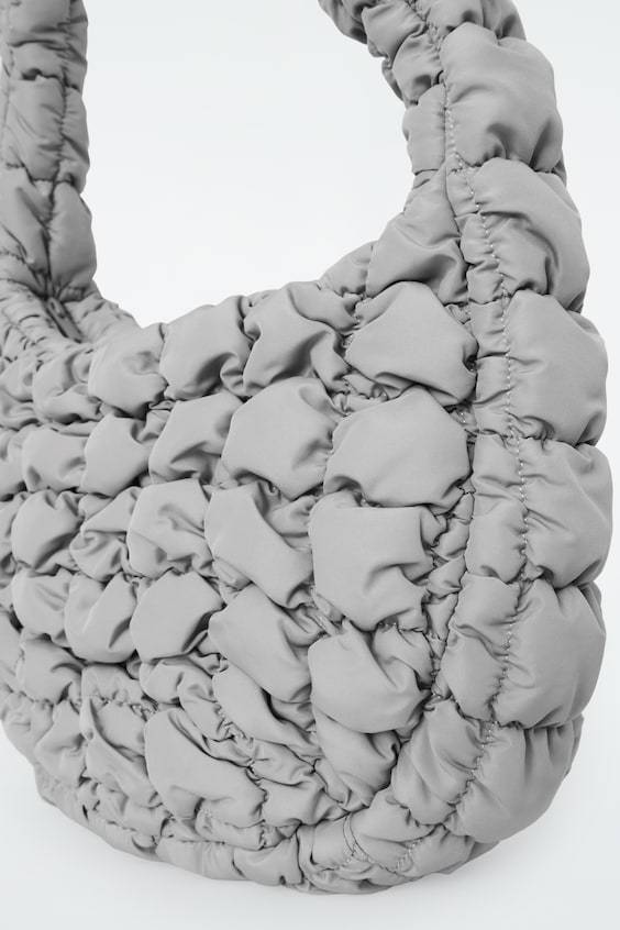 HM KLEINE GESTEPPTE TASCHE