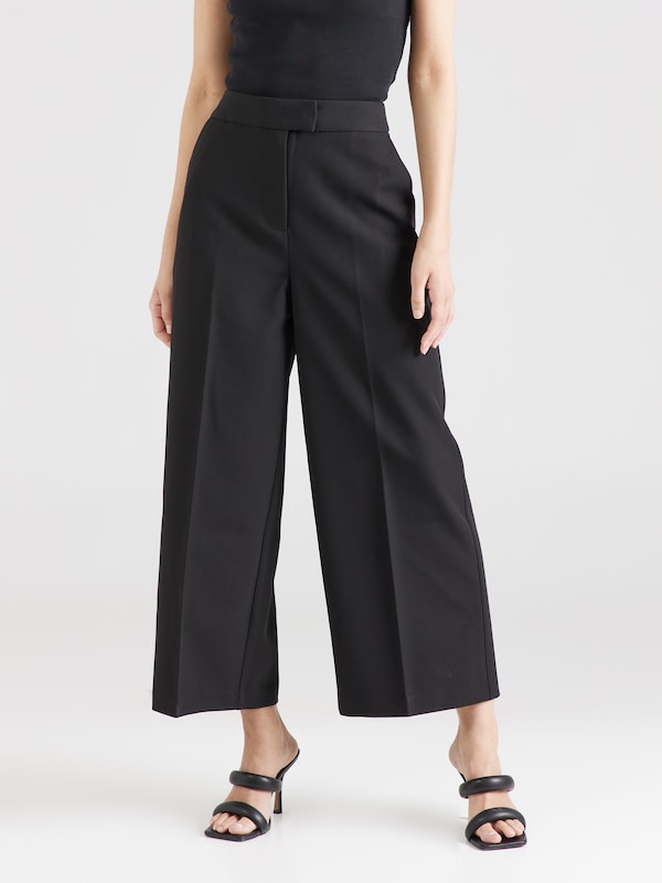 ABOUT YOU x Iconic by Tatiana Kucharova Wide leg Pleated Pants 'Vicky' in Black