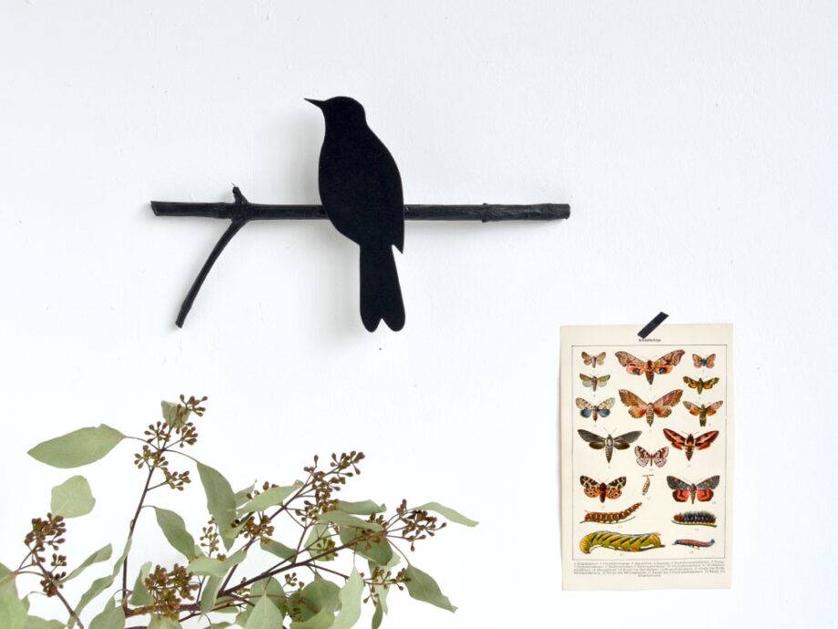 Renna Deluxe Amsel In Fraktur Auf Dem Ast