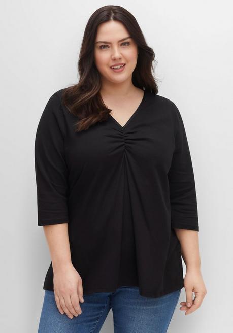 sheego Shirt aus Jersey, mit V-Ausschnitt und Kellerfalte - schwarz sheego