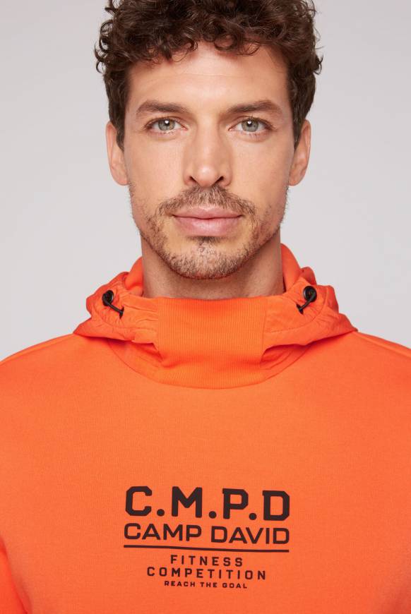 Soccx Hoodie Im Materialmix Mit Artwork Und Rückentasche Signal Orange