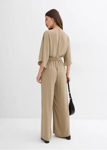 Bonprix Eleganter Jumpsuit Mit Einem Voluminösen Weiten Bein Einem Schlüssellochausschnitt Und Fließenden Cape-Ärmeln. Der Farblich Passende Gürtel Verleiht Der Lockeren Silhouette Mehr Definition